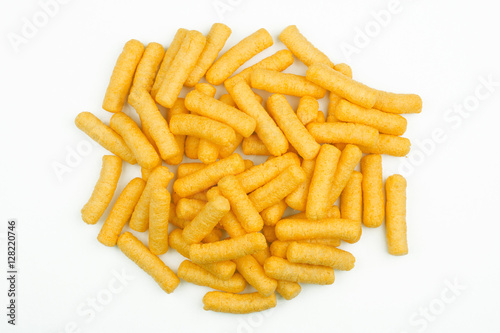 top view of corn puff snacks pile isolated on white