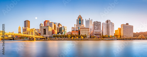 Long exposure of Pittsburgh downtown skyline and Roberto Clemente bridge, on a sunny afternoon, as viewed from North Shore Riverfront Park, across Allegheny River.
