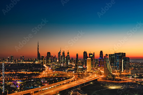 A beautiful Skyline view of Dubai, UAE as seen from Dubai Frame at sunset showing Burj Khalifa, Emirates Towers, Index Building, DIFC, World Trade Centre, H Hotel, Conrad and Etisalat Tower
