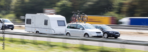 car with a caravan highway speed blur