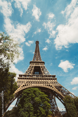 Eiffel Tower. Paris. France. Famous historical landmark on the quay of a river Seine. Romantic, tourist, architecture symbol. Toned