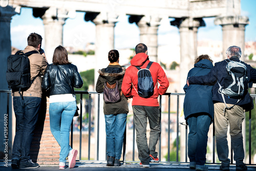 couples of tourists of different ages looking at the Roman Forum