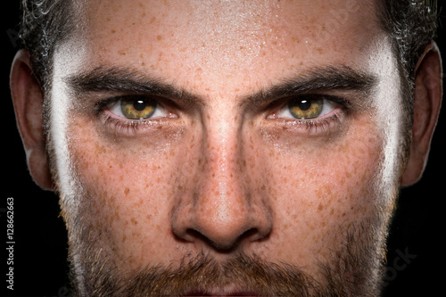 Conviction focused determined passionate confident powerful eyes stare intense athlete exercise trainer male 