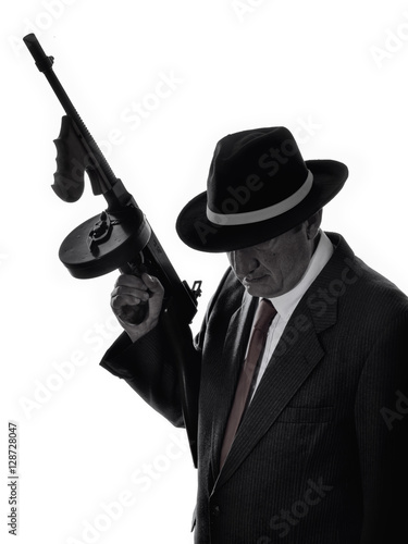 Old style gangster with tommy gun, on white background