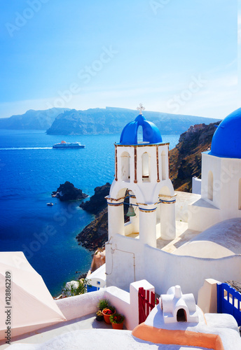 view of caldera with stairs and bellfry with blue dome, Oia, Santorini, Greece, retro toned
