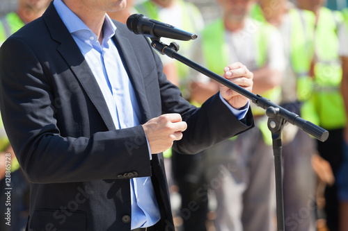 Businessman or politician is giving a speech