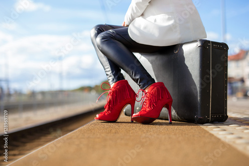 Woman in high heels at train station