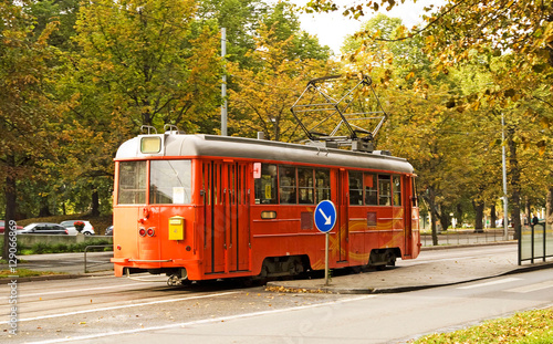 Red tram on street of Stockholm, Sweden