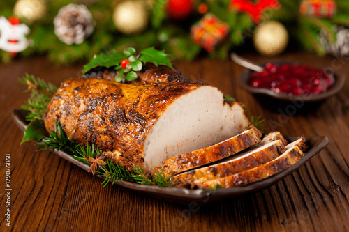 Roast pork loin with Christmas decoration.