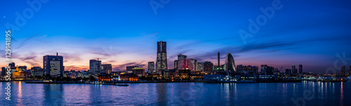 Wide panorama of Yokohama Minato Mirai 21 seaside urban area in Japan at dusk