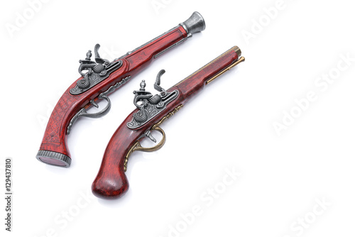 Vintage pistol on white background - Prussian antique flintlock pistol with copy space. 