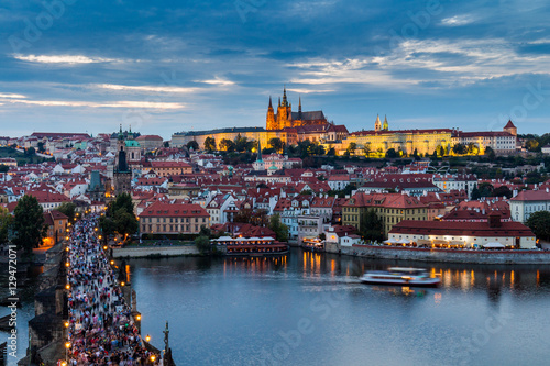 Panorama of Prague Castle and St. Vitus cathedral in twilight with dramatic sky. Prague, Czech Republic