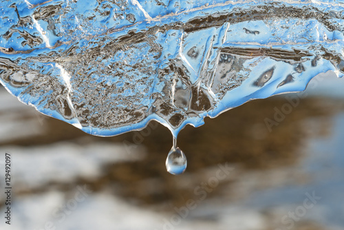 Drop of melt water off ice.