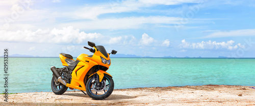 Panoramic scene of sport motorcycle at the beach