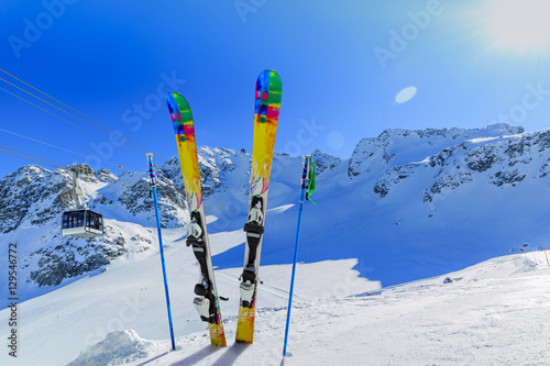 Ski winter season - mountains, cable car and ski equipments on s