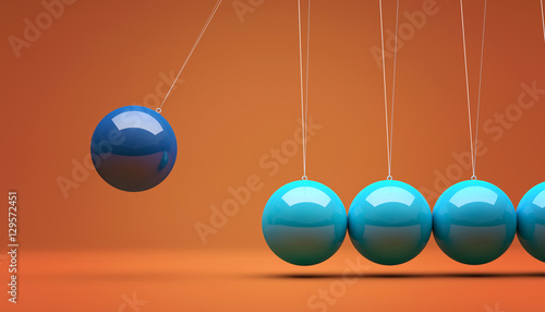 blue newton pendulum on orange background. time, teamwork, business