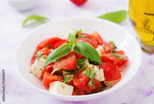 Fresh salad with tomato, mozzarella and basil