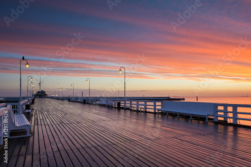 Pier in Sopot at sunrise time with amazing colorful sky. Poland. Europe.