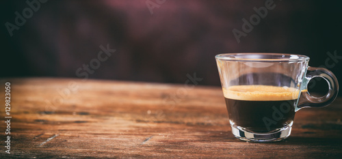 Transparent cup of espresso
