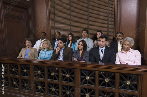 Group of jurors sitting together in jury box during trial