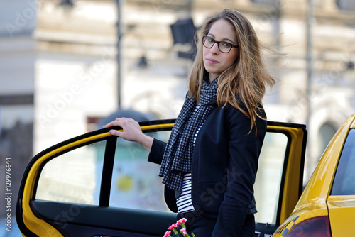 Yellow cab and a woman.