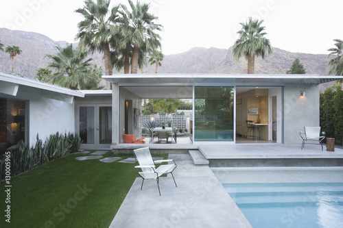 View of swimming pool and modern home exterior