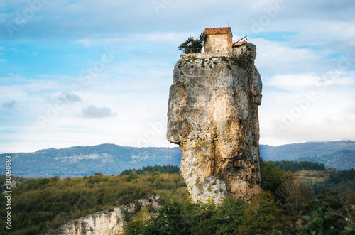 Katskhi pillar. Georgian landmarks. Man's monastery near the village of Katskhi. The orthodox church and the abbot cell on a rocky cliff. Imereti, Georgia. Georgian Meteora