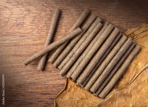 Cigarillo on wooden background