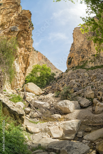 Fisheye view on Avakas Gorge with steep rocks and river on bottom. Akamas peninsula, Cyprus. 