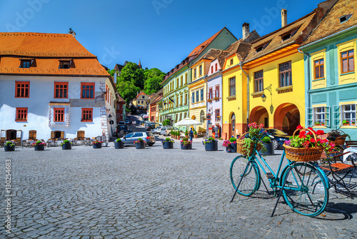 Famous medieval street cafe bar,Sighisoara,Transylvania,Romania,Europe