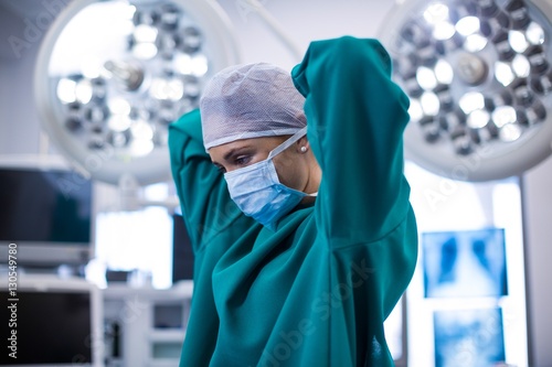 Female surgeon wearing surgical mask