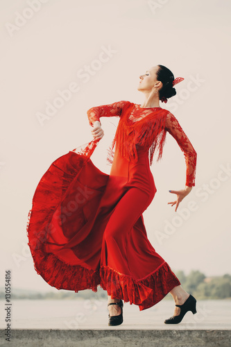 Flamenco dancer Spain womans in a long red dress