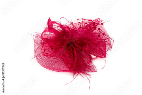Women in red hat with a veil. Red hair accessory with feather. Fancy, party hat. Isolated on white background. Closeup.