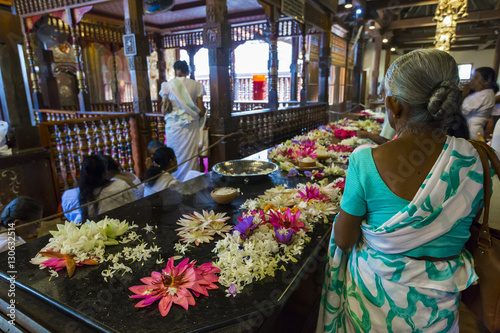 Temple Of The Sacred Tooth RelicThe inside view. People bring flowers to the Temple. Kandy, Sri Lank
