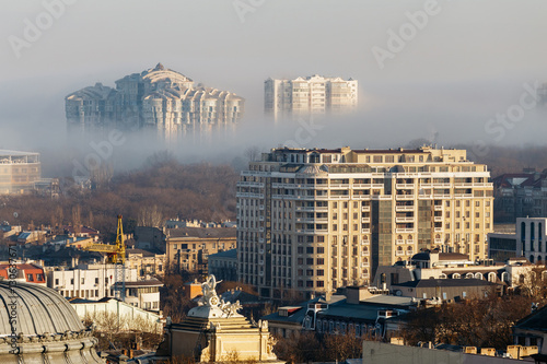 Top view of the city of Odessa. Between the houses the fog