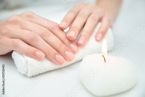 Woman getting nail manicure.