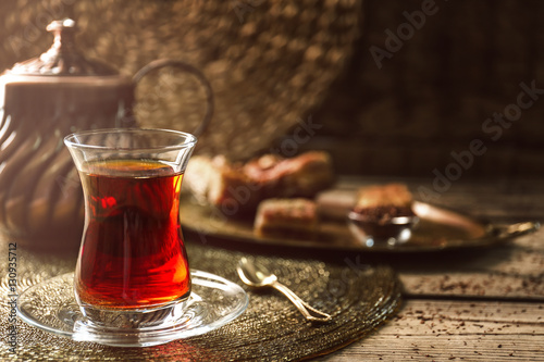 Turkish tea in traditional glass on tray closeup