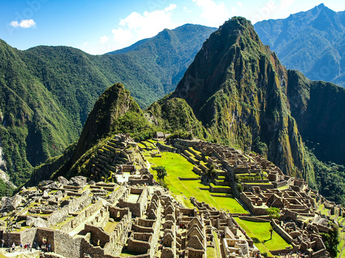 Machu Picchu, peruvian lost city of Incas situated on mountain ridge above Sacred Valley of Urubamba River in Cusco Region, Peru. UNESCO World Heritage and one of the New Seven Wonders of the World