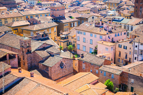 Beautiful view from the roof of ancient old buildings with red roofs in Lucca, Italy