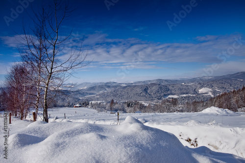 Słoneczny zimowy dzień w górskim mieście Muszyna. Sunny winter day in the mountain in Muszyna - Poland. Polish mountain landscape 