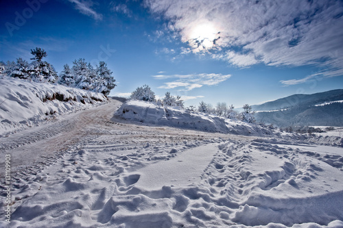 Słoneczny zimowy dzień w górskim mieście Muszyna. Sunny winter day in the mountain in Muszyna - Poland. Polish mountain landscape Snowy mountain in Muszyna - Poland.