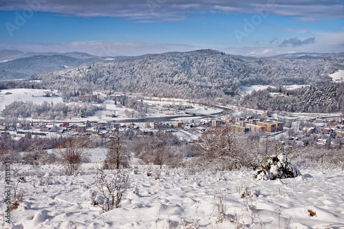 Słoneczny zimowy dzień w górskim mieście Muszyna. Sunny winter day in the mountain in Muszyna - Poland. Polish mountain landscape Snowy mountain in Muszyna - Poland.