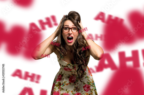 Frustrated and overwhelmed woman full of stress and anxiety shouts, hysterical, freaking out