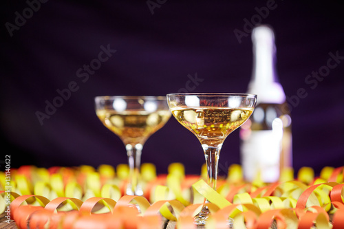Streamers decoration on table and glass of champagne