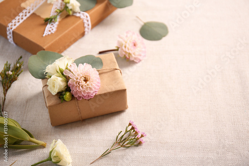 Handcrafted gift box with flowers on table