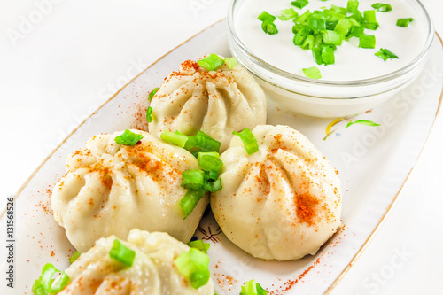 Georgian dumplings Khinkali with meat and green onion