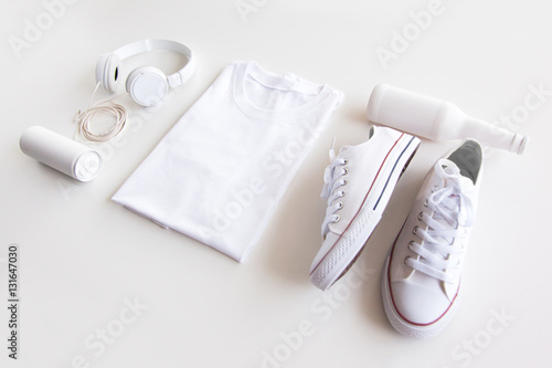 Blank stuff on white background. Template for design presentations. Branding Mock-Up. Shirt, sneakers, headphones, bottle.
