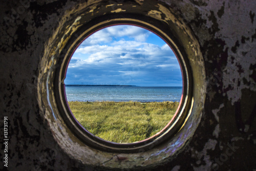 View from a round ruined windows building to the sea