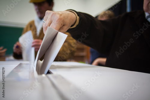 Person voting at polling station