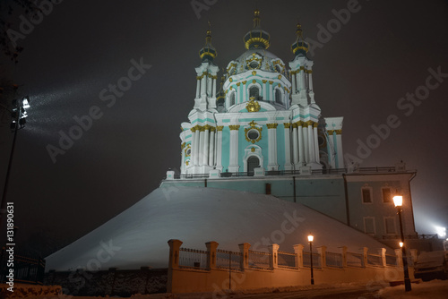 Winter evening in Kyiv, Ukraine. Andriyivs'ka tserkva (The Saint Andrew's Church) in snowfall.
